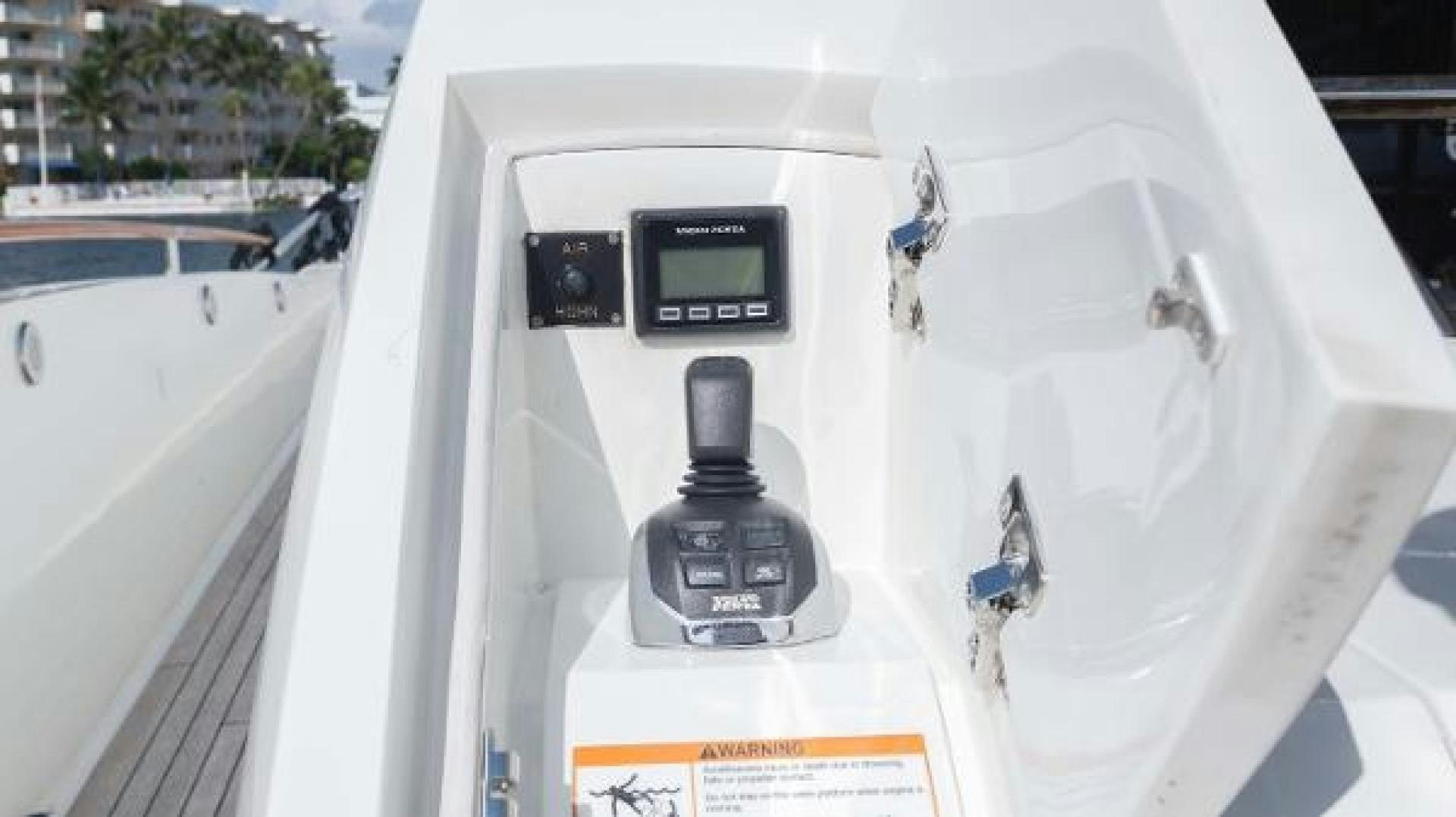 a white car with a black light aboard Z Yacht for Sale