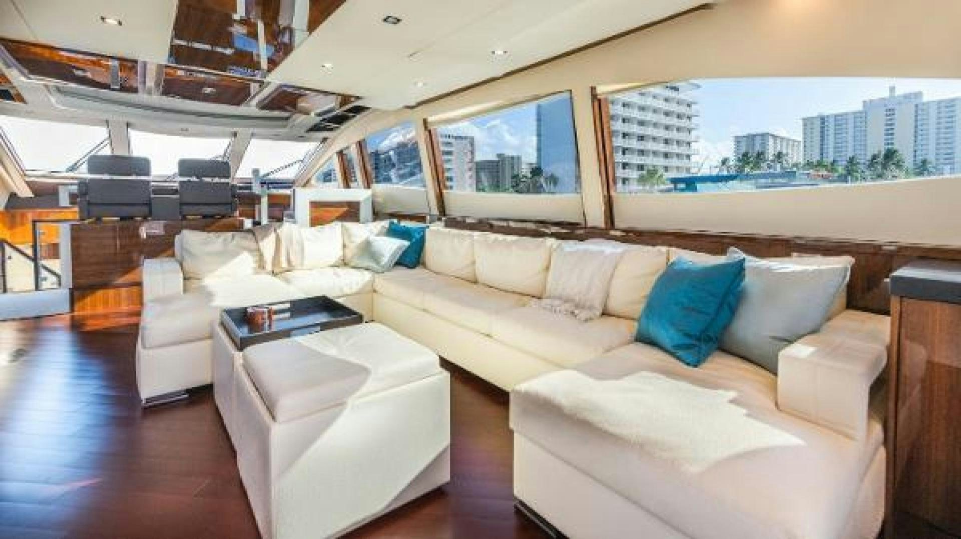 a living room with a couch and a table aboard Z Yacht for Sale