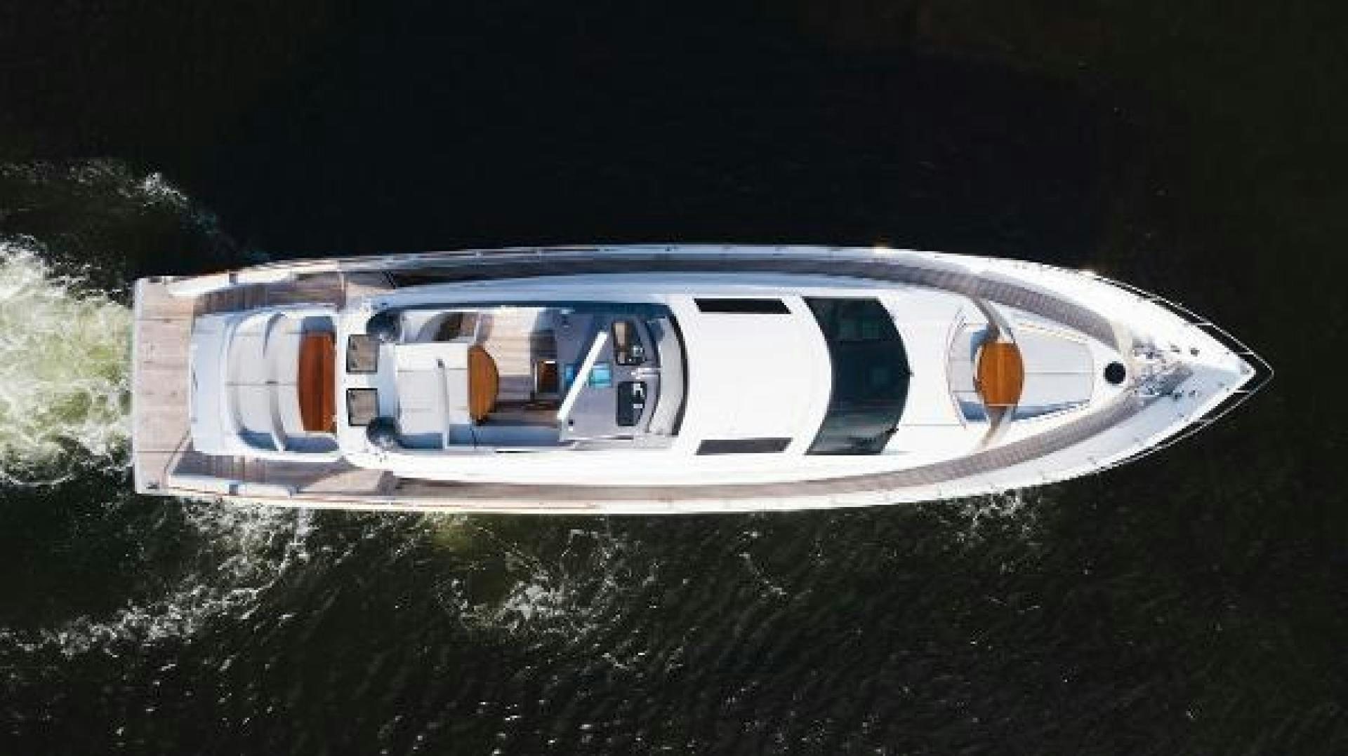 a white car with a door open aboard Z Yacht for Sale