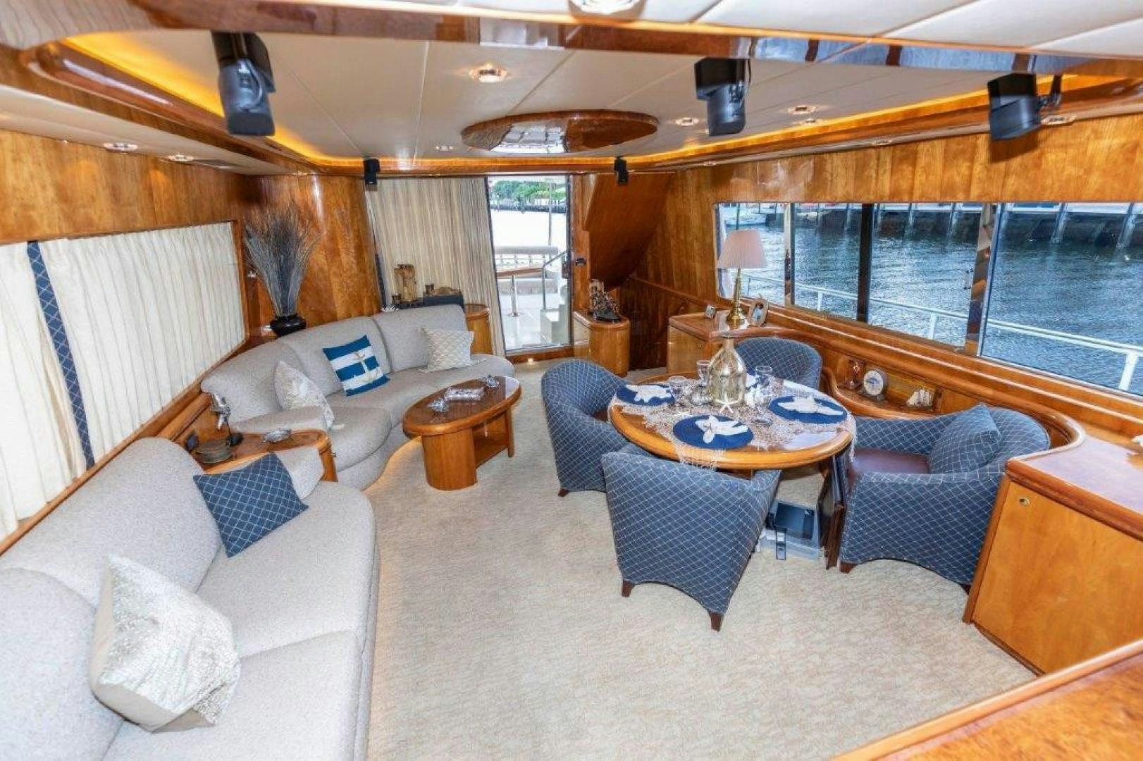 a living room with a large window aboard BELISARIUS Yacht for Sale