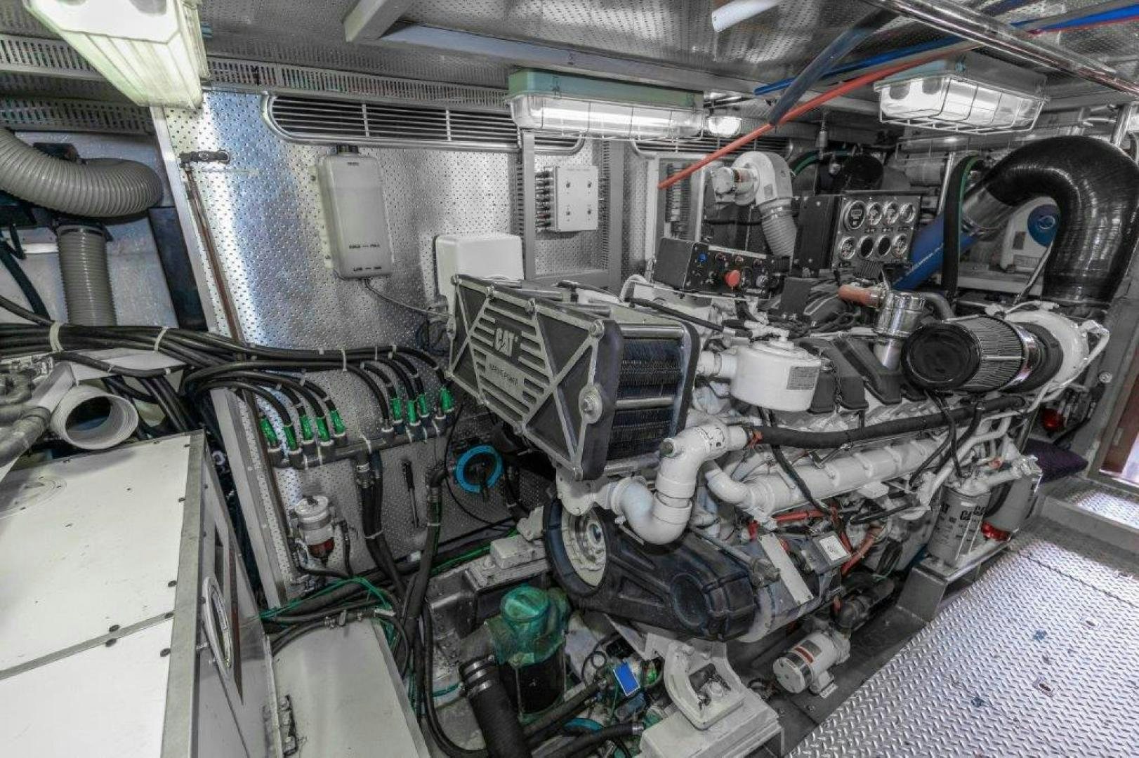 a car engine with a lot of wires and a white object aboard BELISARIUS Yacht for Sale