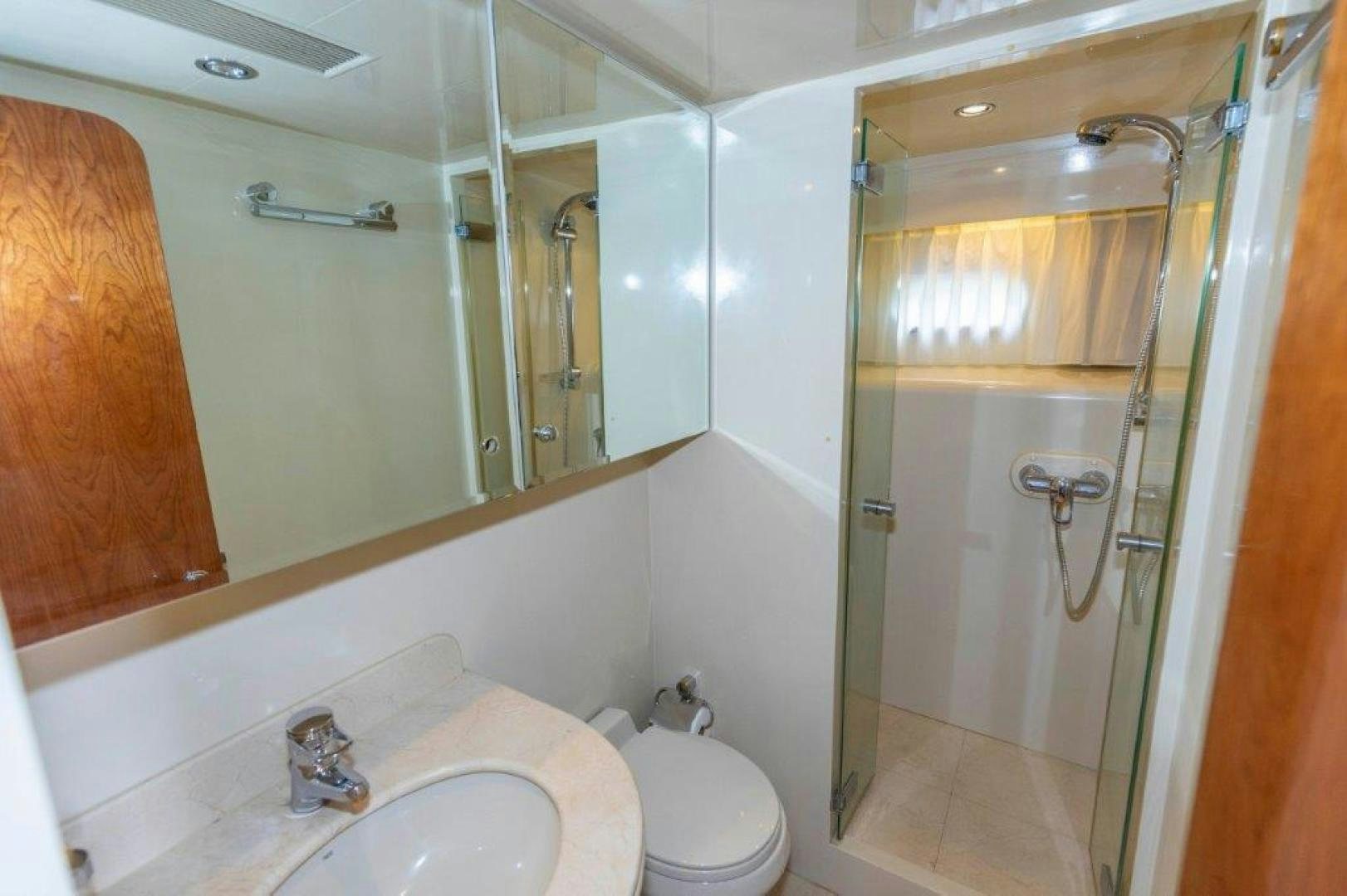 a bathroom with a glass shower aboard BELISARIUS Yacht for Sale