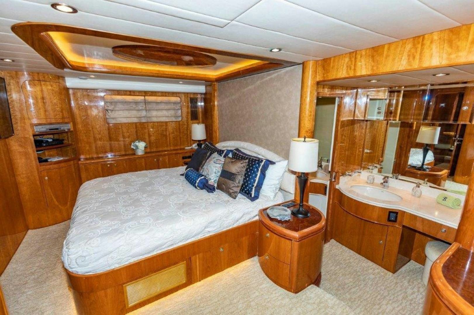 a bedroom with a bed and a sink aboard BELISARIUS Yacht for Sale