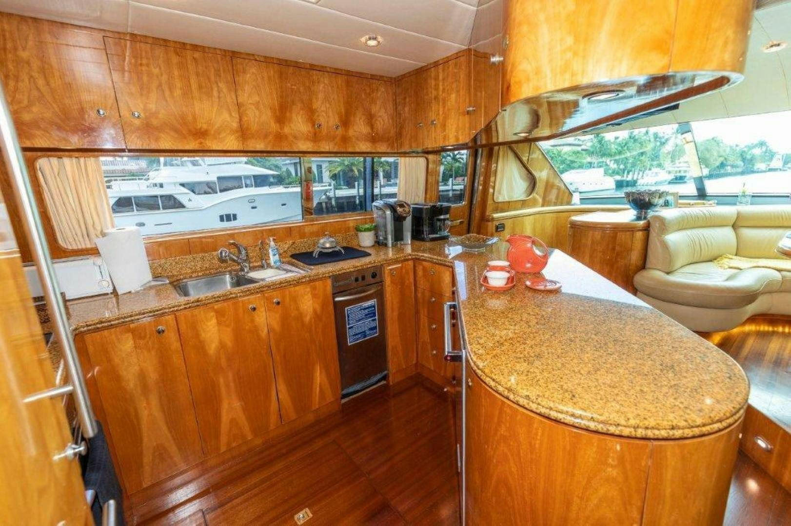 a kitchen with wooden cabinets aboard BELISARIUS Yacht for Sale