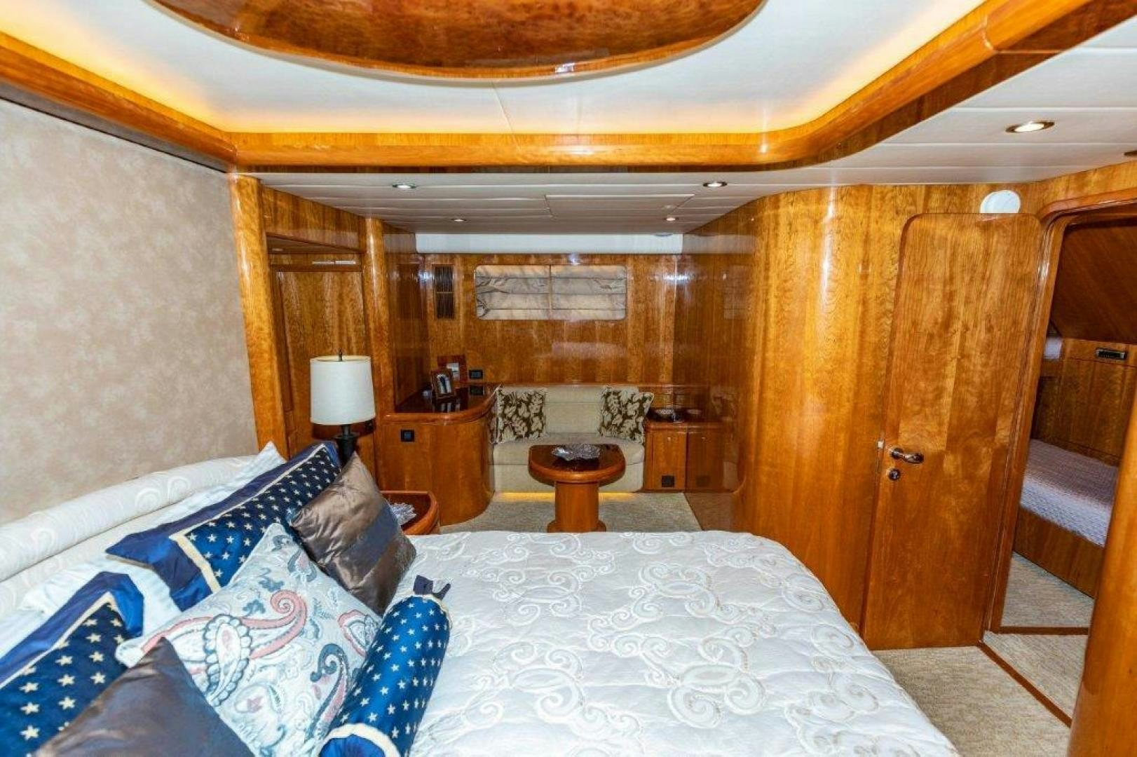a bed with white sheets and pillows aboard BELISARIUS Yacht for Sale