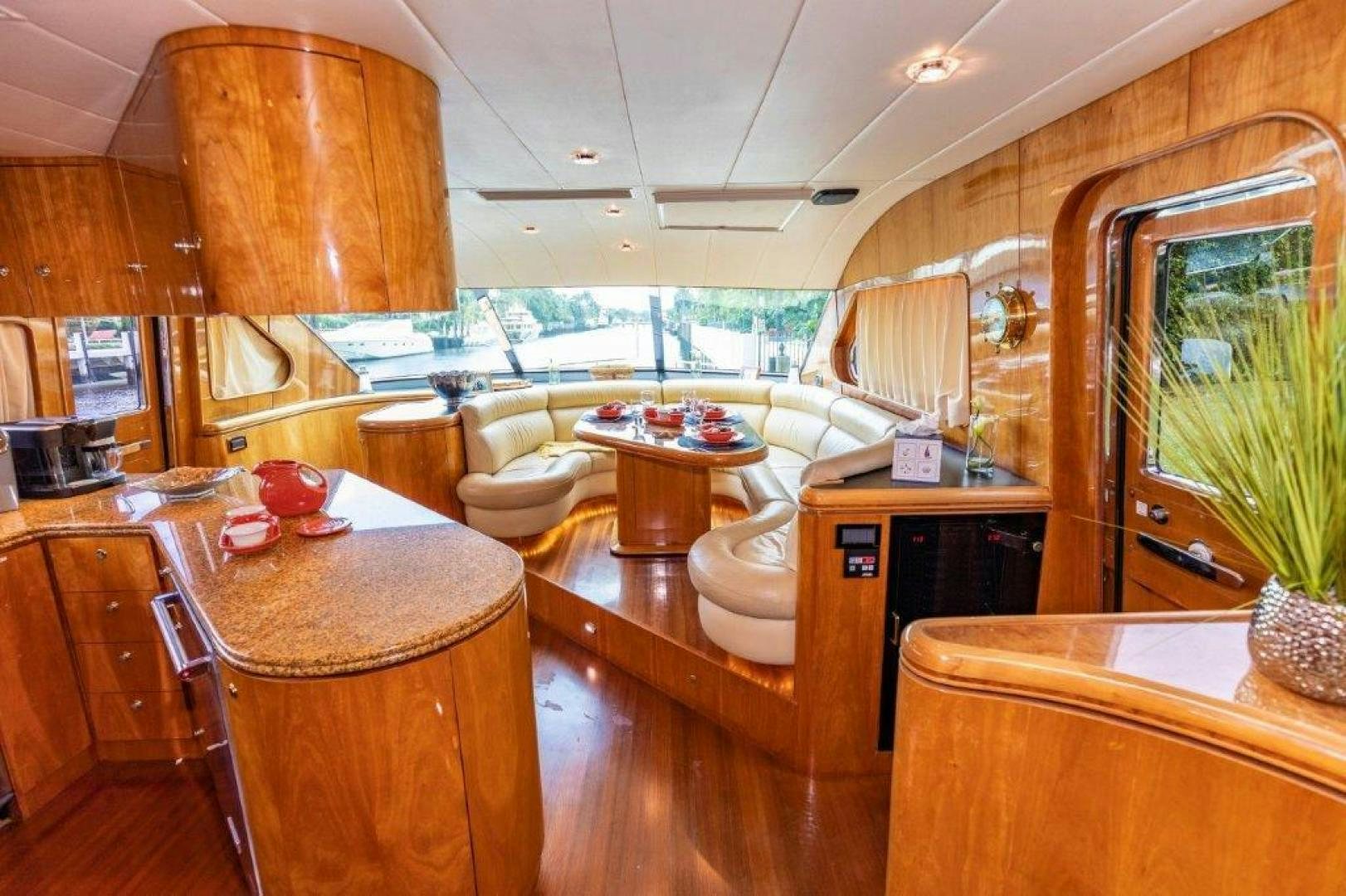 a large kitchen with a dining table aboard BELISARIUS Yacht for Sale