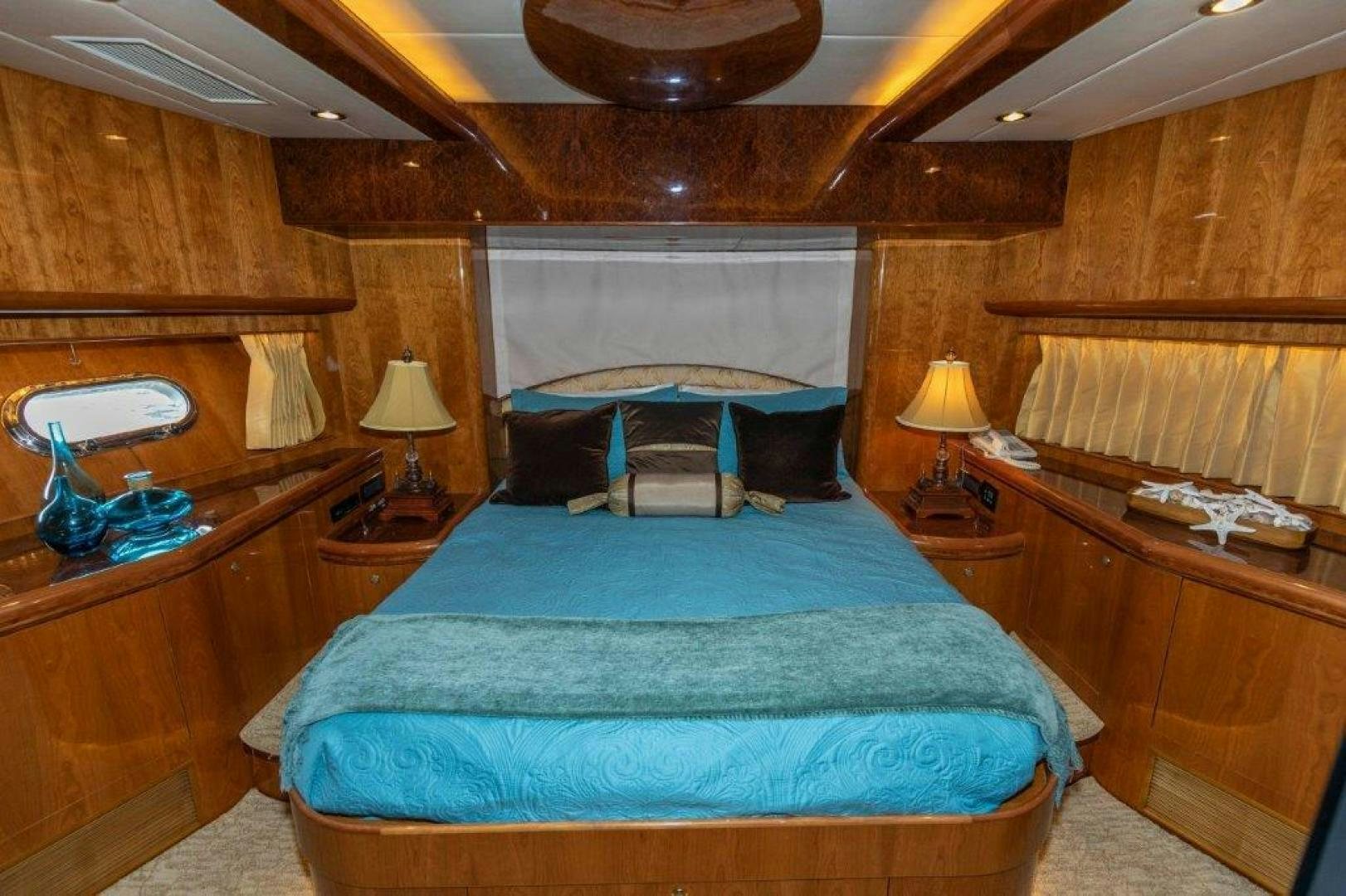 a bedroom with a bed and a desk aboard BELISARIUS Yacht for Sale