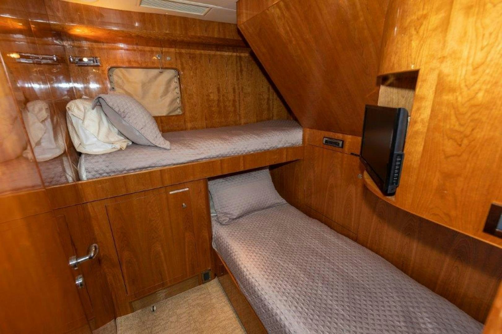 a bed with a television on top of it aboard BELISARIUS Yacht for Sale