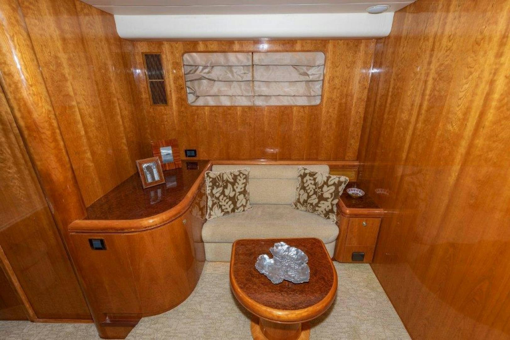 a living room with a couch and a coffee table aboard BELISARIUS Yacht for Sale