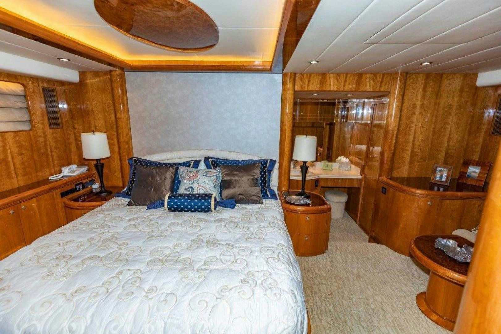 a bedroom with a bed and a desk aboard BELISARIUS Yacht for Sale