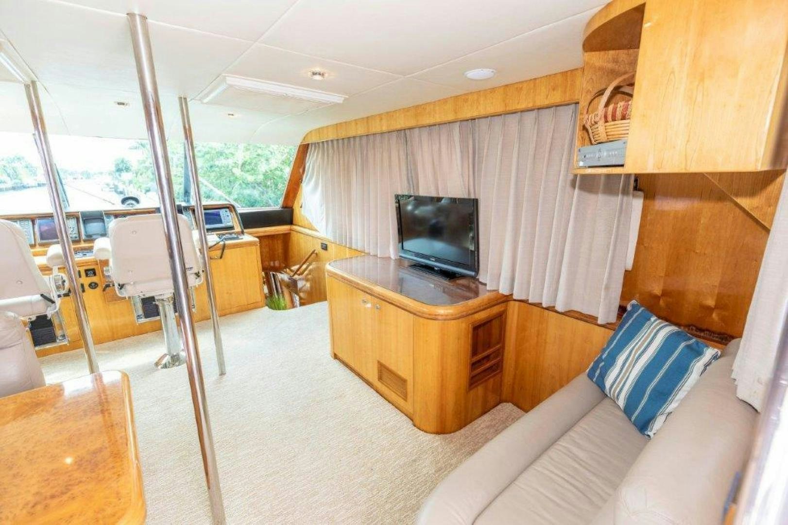 a living room with a tv and a couch aboard BELISARIUS Yacht for Sale