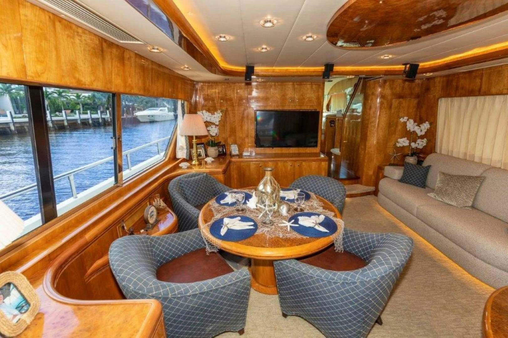 a living room with a large window aboard BELISARIUS Yacht for Sale