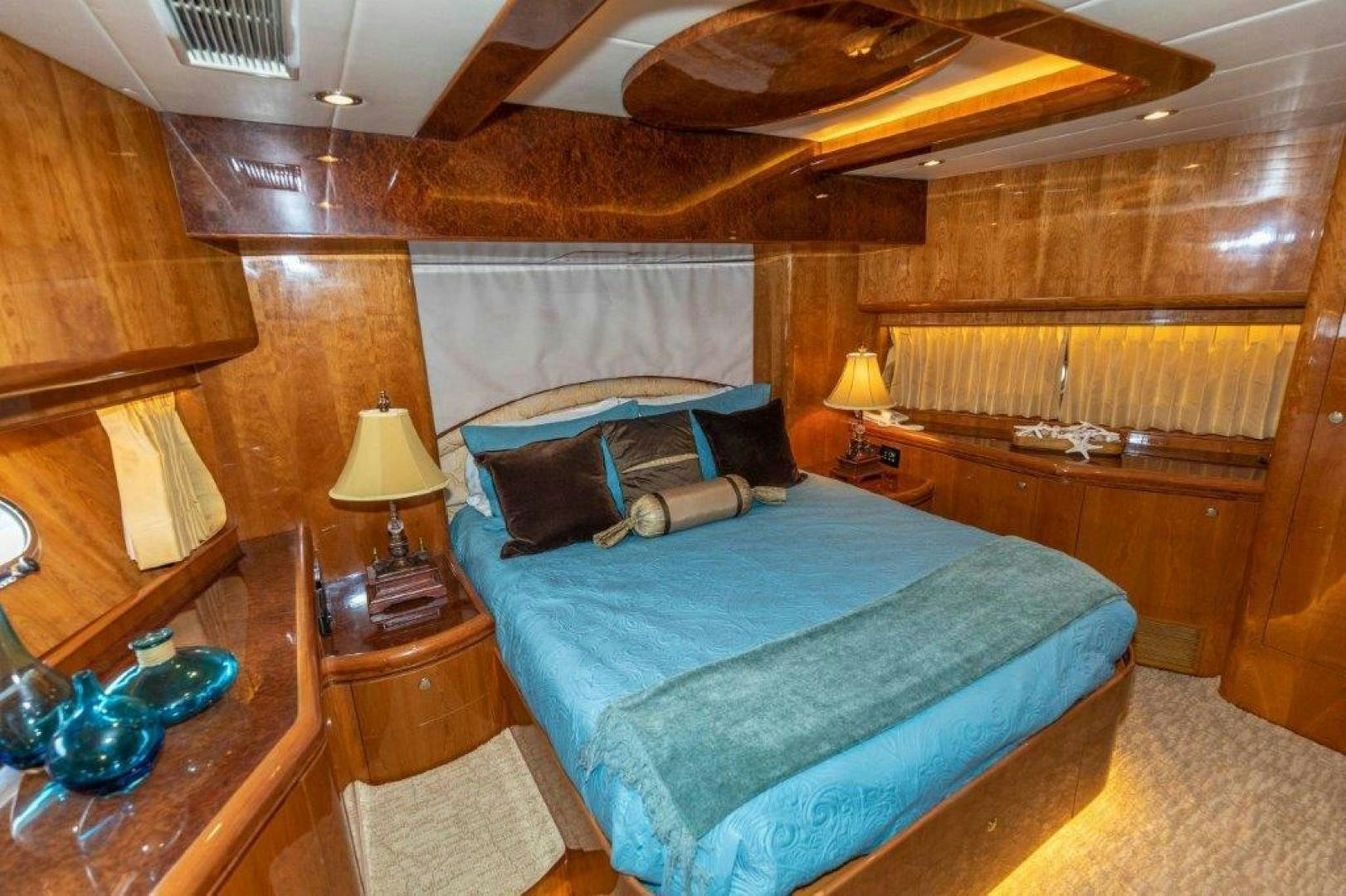 a bedroom with a bed and a table aboard BELISARIUS Yacht for Sale