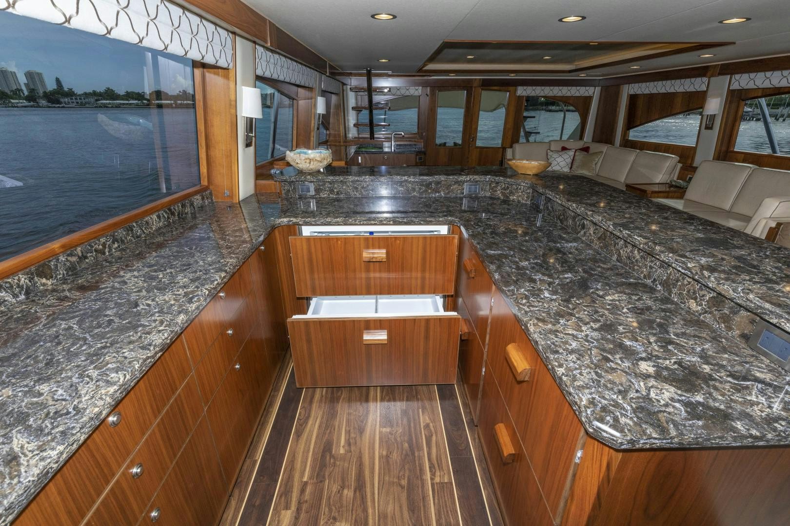 a large kitchen with wood cabinets aboard BELLA DONA DI Yacht for Sale
