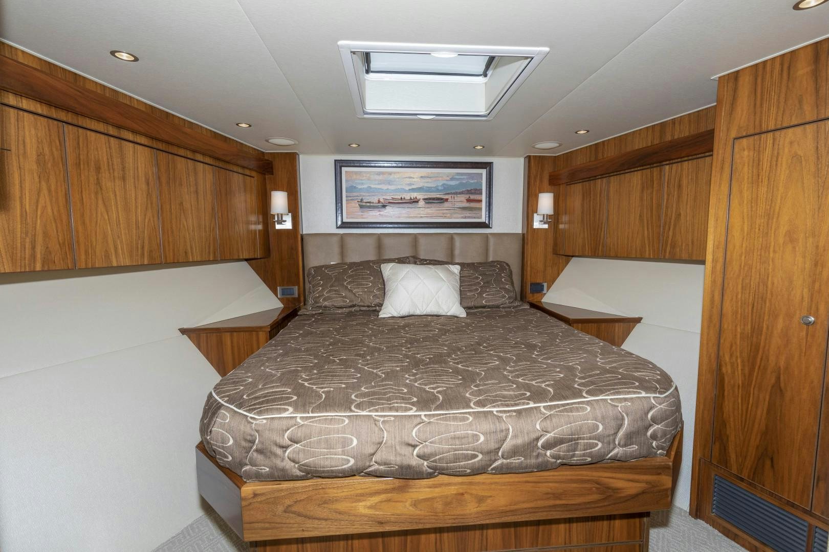 a bedroom with a bed and a wood wall aboard BELLA DONA DI Yacht for Sale