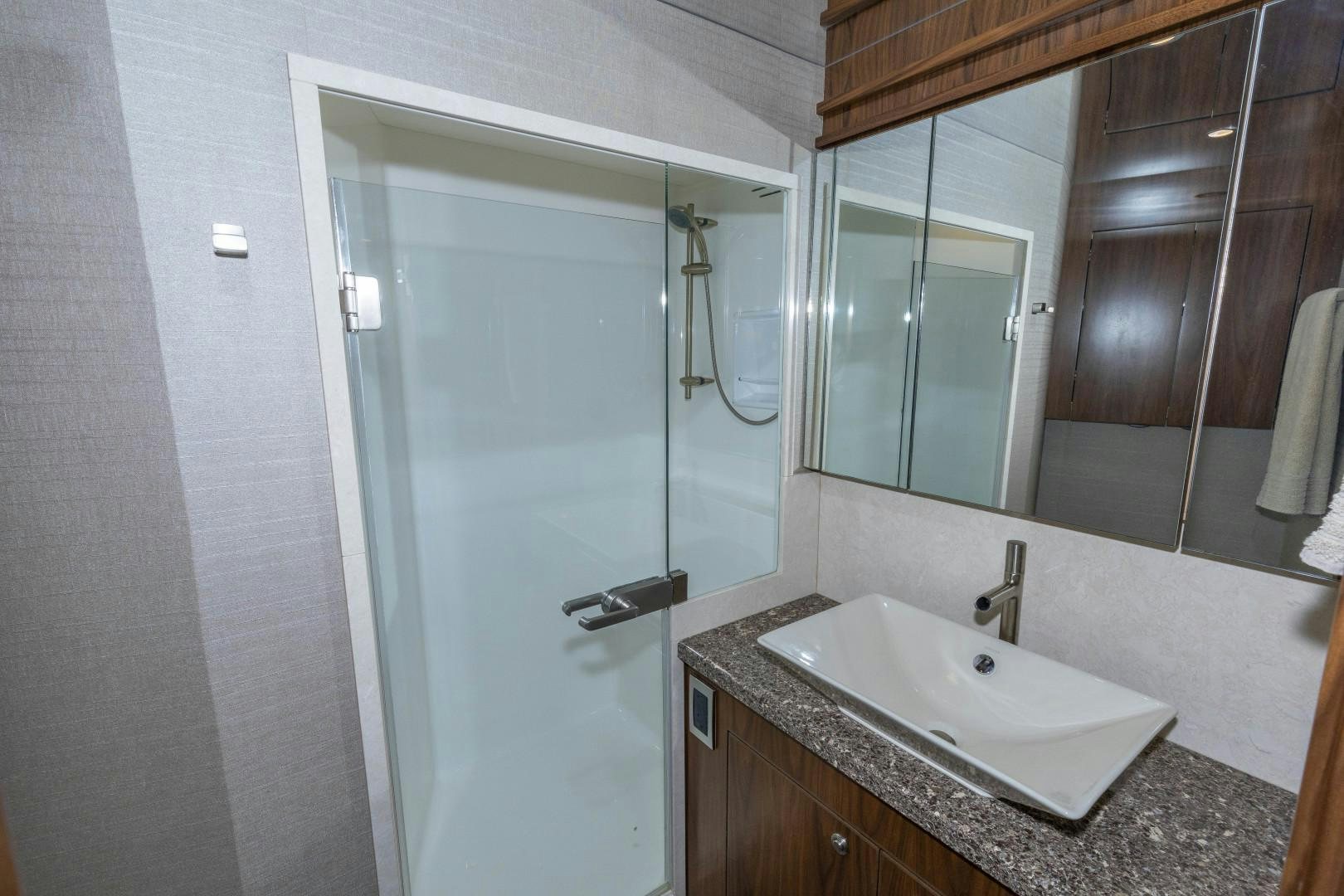 a bathroom with a glass shower aboard BELLA DONA DI Yacht for Sale