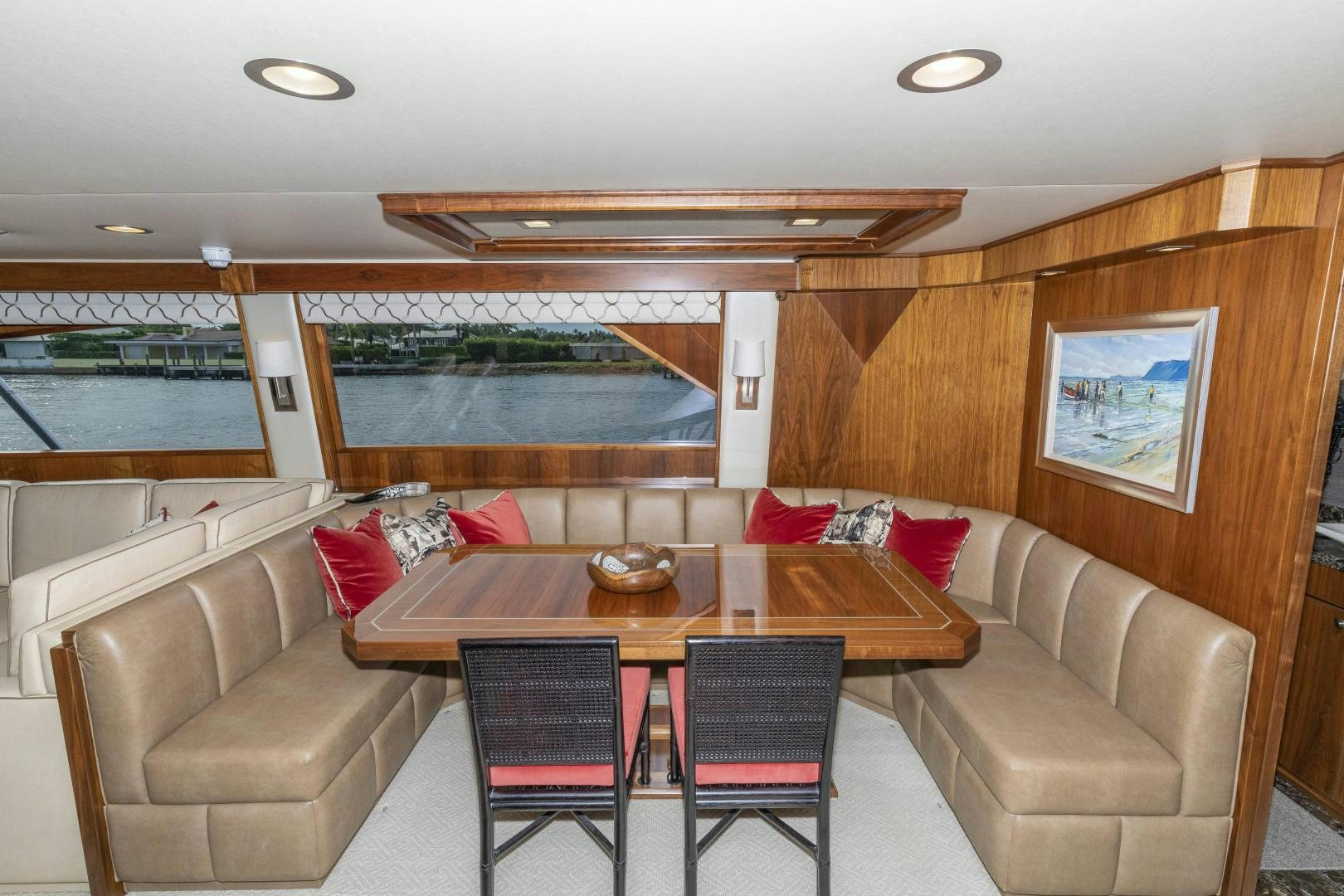 a living room with a table and couches aboard BELLA DONA DI Yacht for Sale
