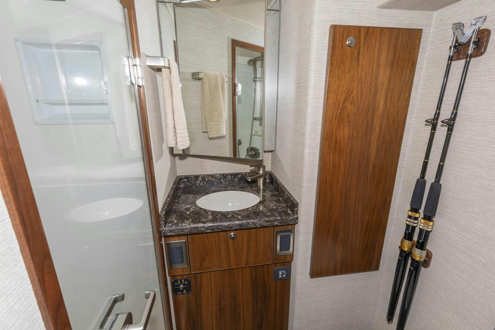 a bathroom with a sink and a mirror aboard BELLA DONA DI Yacht for Sale