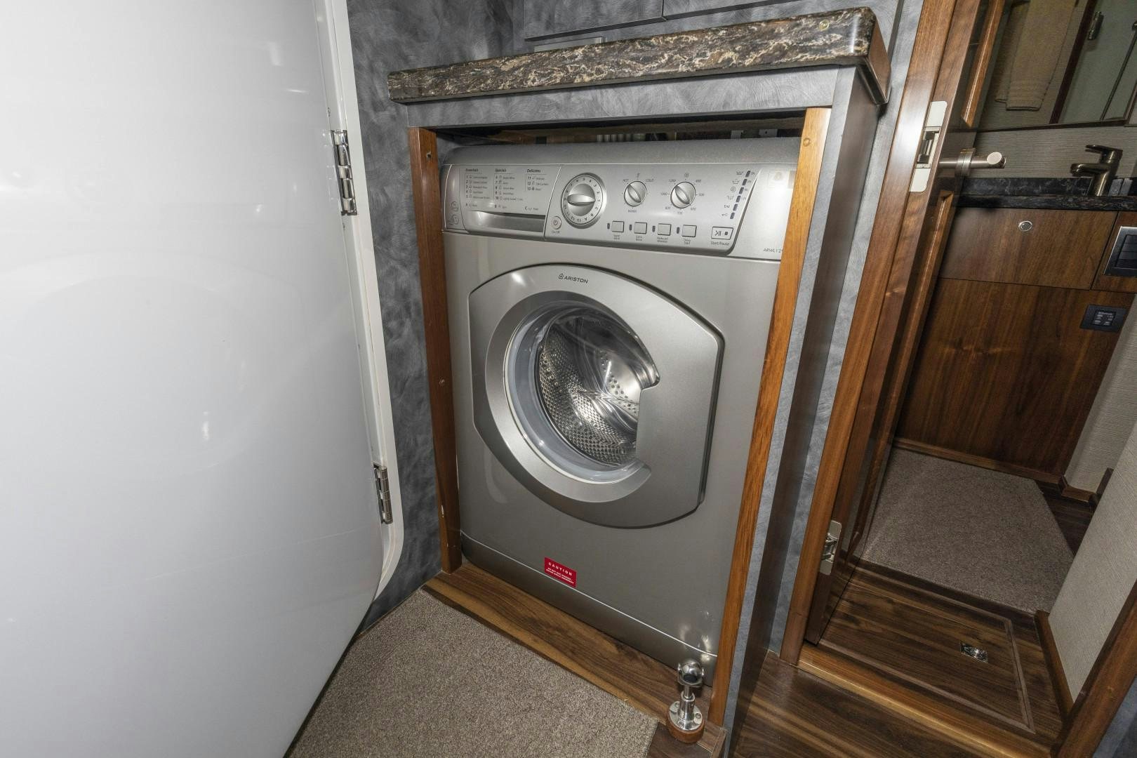 a washer and dryer in a room aboard BELLA DONA DI Yacht for Sale