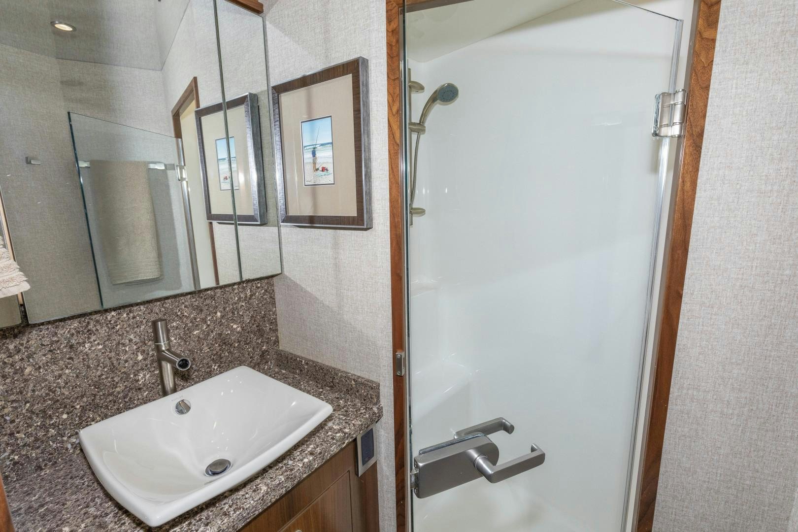 a bathroom with a marble countertop aboard BELLA DONA DI Yacht for Sale
