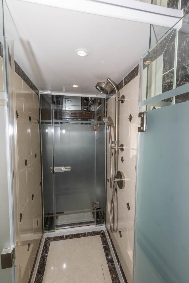 a bathroom with a shower and a sink aboard BELLA DONA DI Yacht for Sale