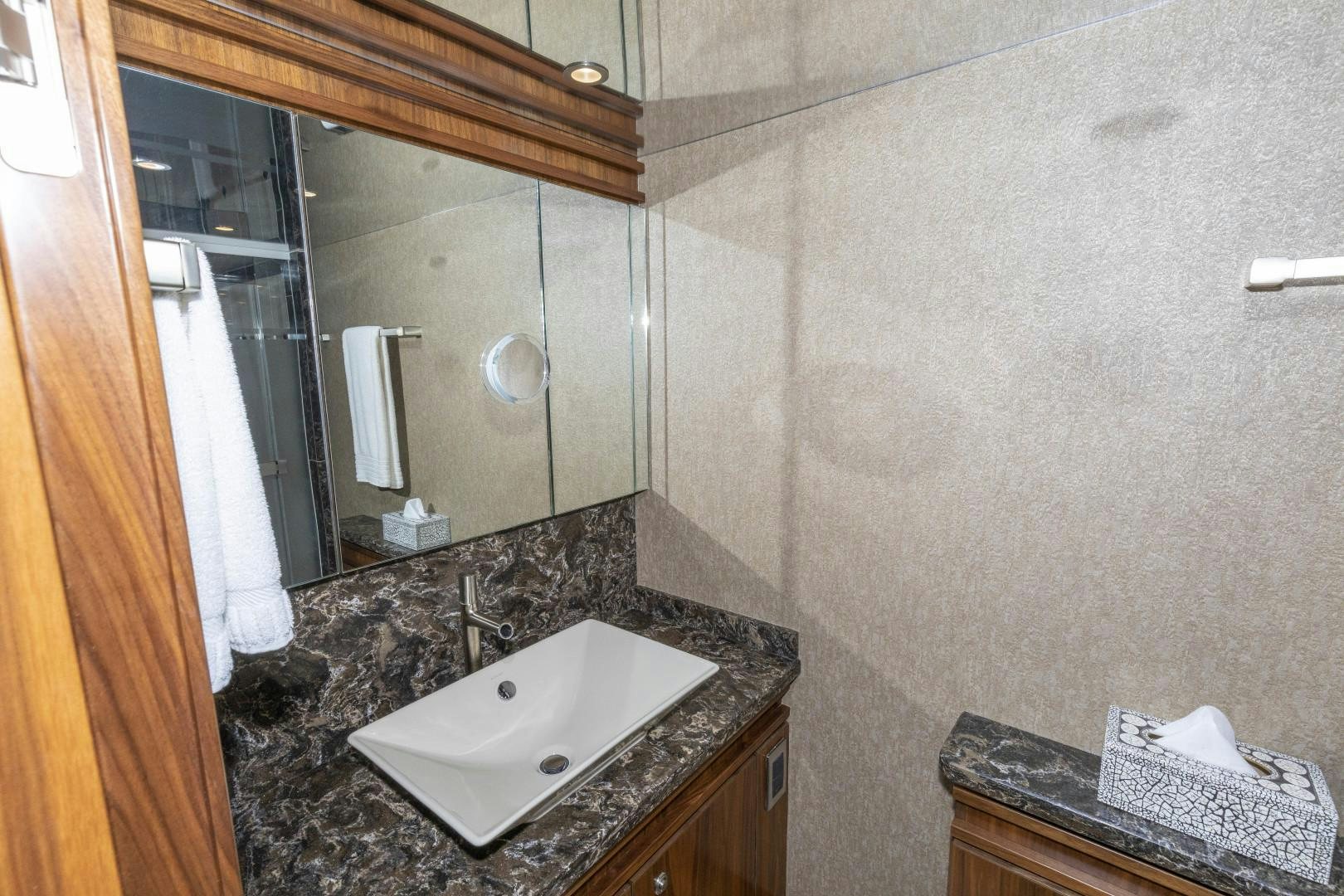a bathroom with a large mirror aboard BELLA DONA DI Yacht for Sale