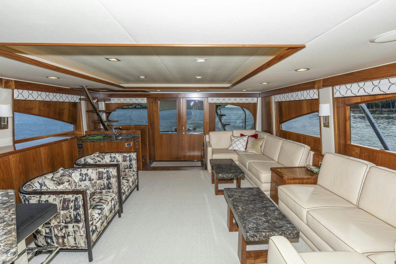 a living room with a large window aboard BELLA DONA DI Yacht for Sale