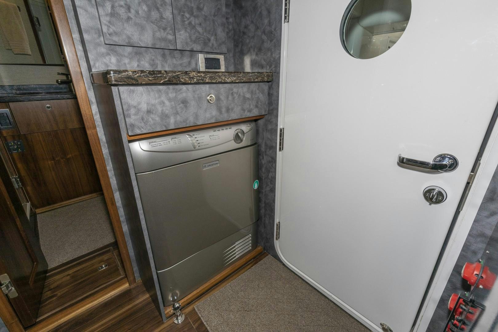 a room with a washer and dryer aboard BELLA DONA DI Yacht for Sale