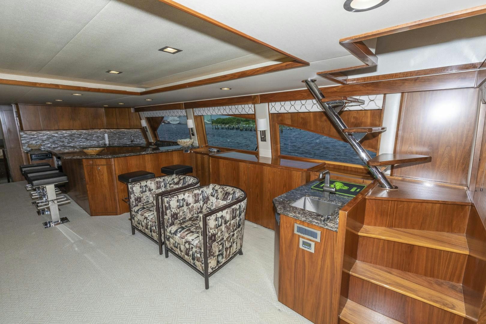 a large room with a table and chairs aboard BELLA DONA DI Yacht for Sale