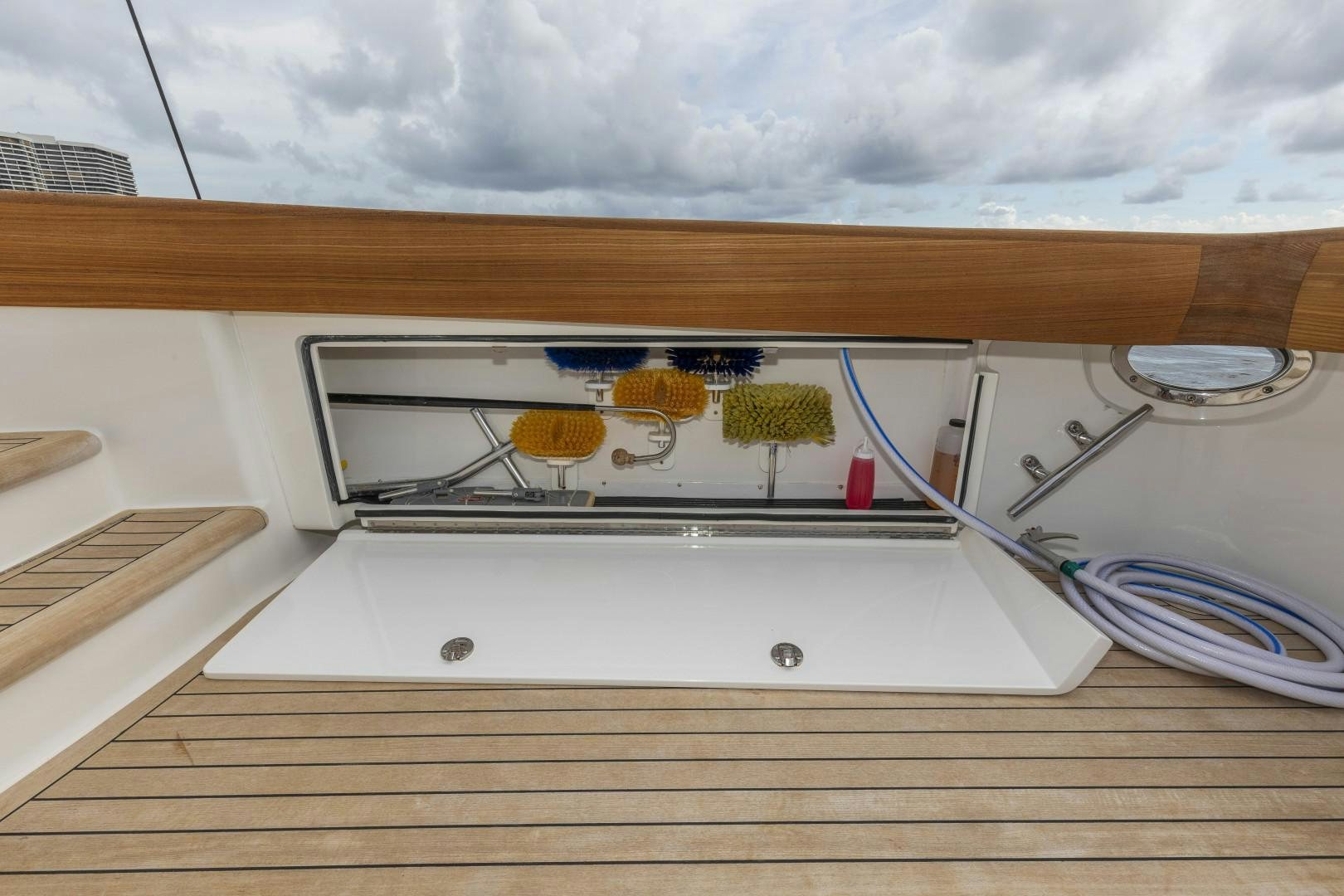 a wooden table with a glass window aboard BELLA DONA DI Yacht for Sale