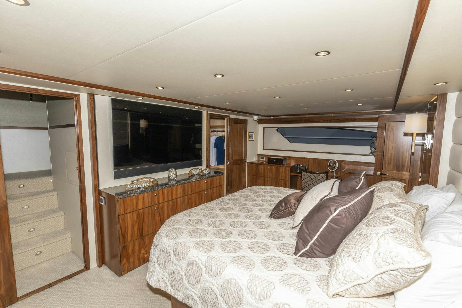 a bedroom with a bed and a television aboard BELLA DONA DI Yacht for Sale