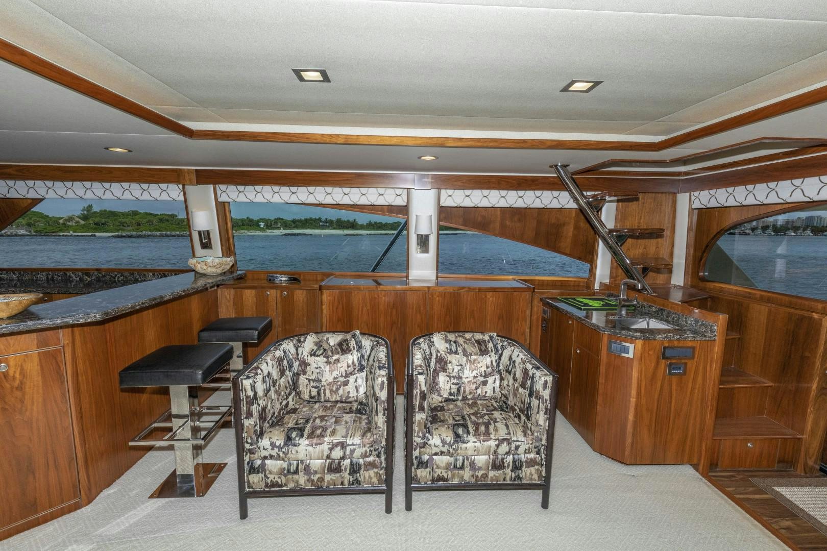 a room with chairs and a table aboard BELLA DONA DI Yacht for Sale