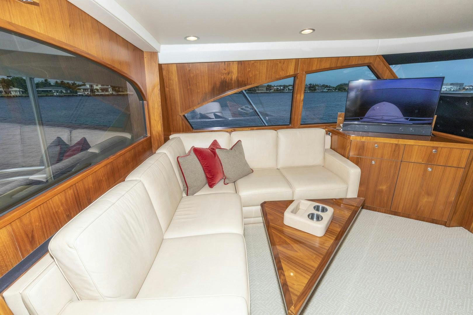 a living room with a couch and a tv aboard BELLA DONA DI Yacht for Sale