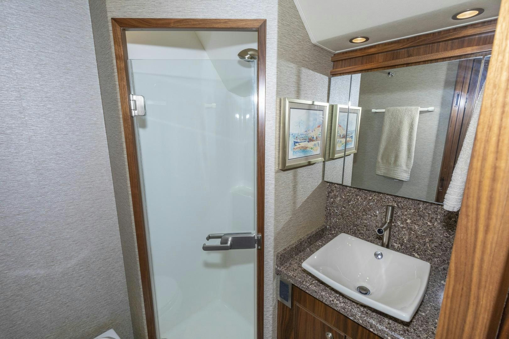 a bathroom with a sink and mirror aboard BELLA DONA DI Yacht for Sale