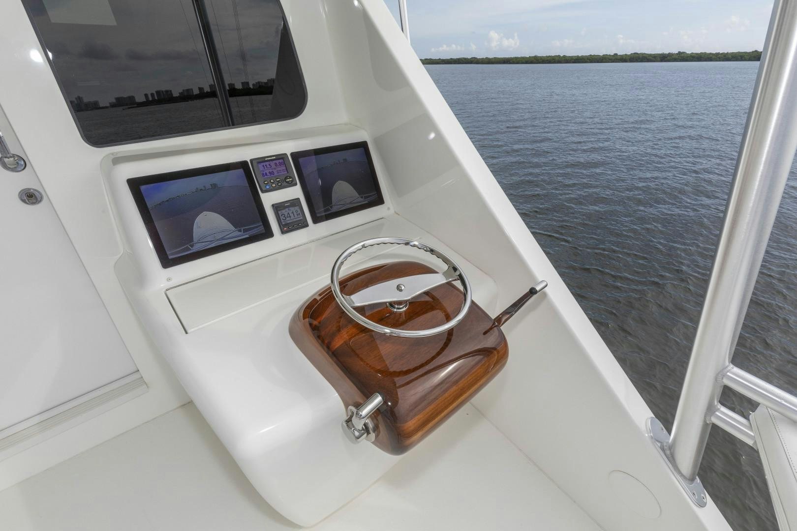 a boat with a watch and a leather seat on the front aboard BELLA DONA DI Yacht for Sale