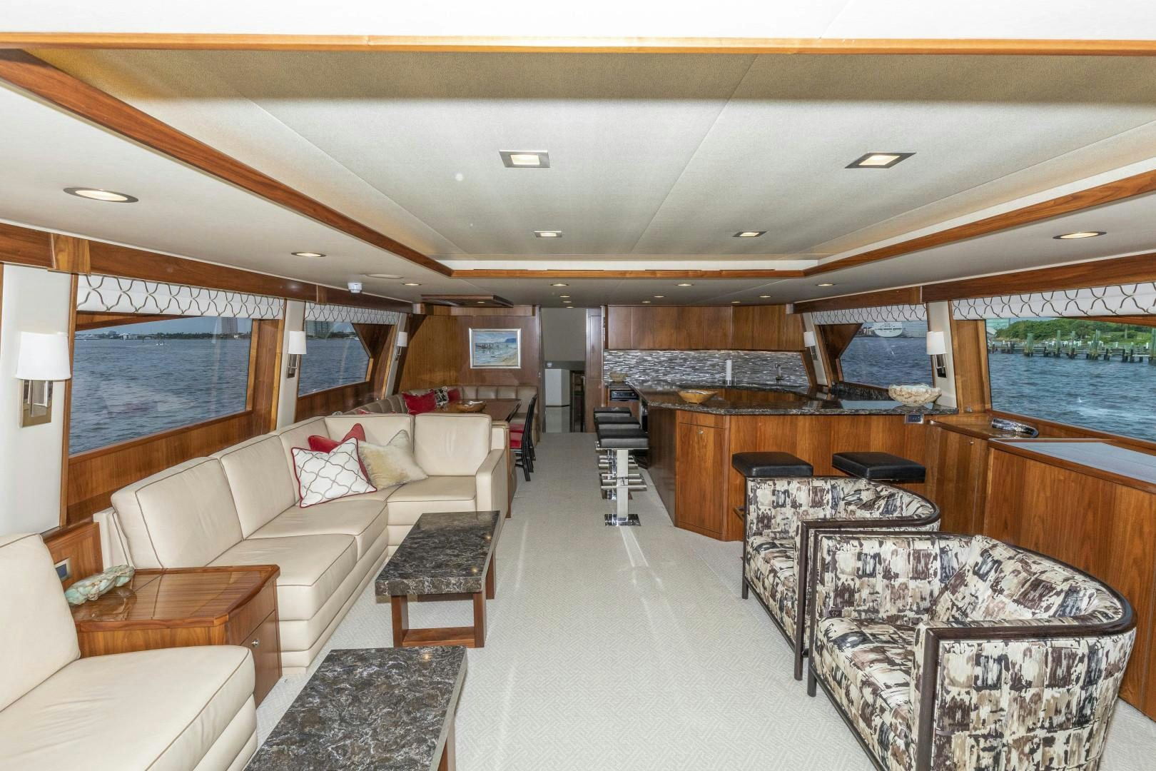 a living room with a large window aboard BELLA DONA DI Yacht for Sale