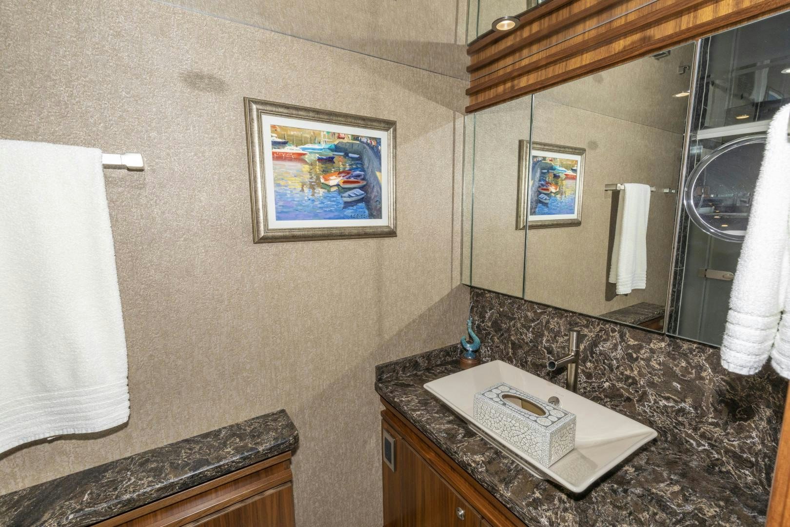 a bathroom with a large mirror aboard BELLA DONA DI Yacht for Sale
