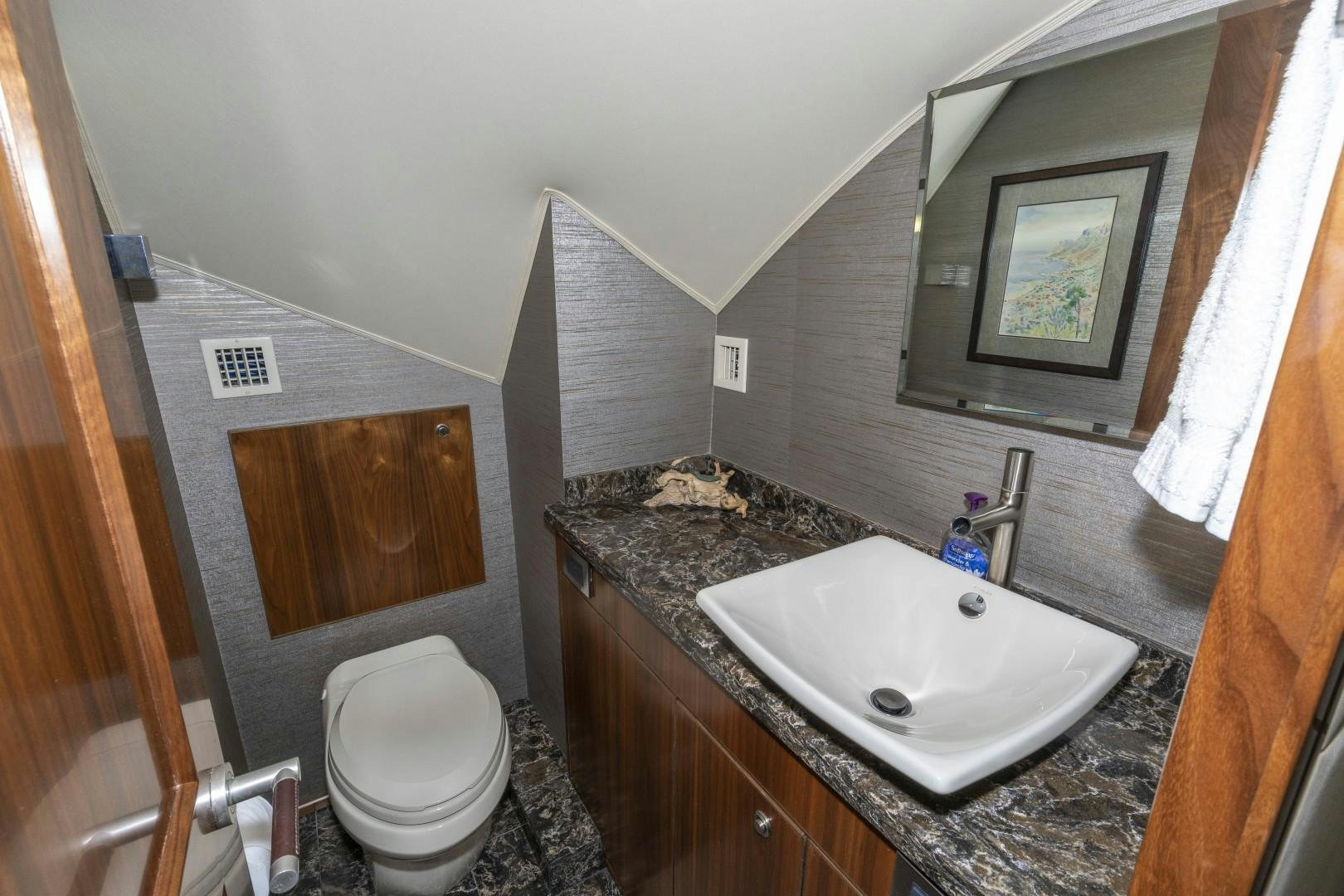 a bathroom with a sink and a toilet aboard BELLA DONA DI Yacht for Sale