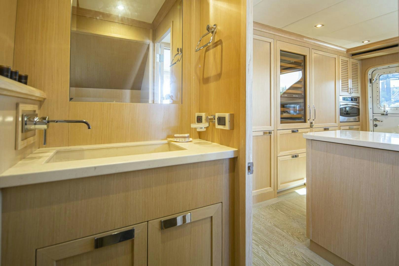 a bathroom with a sink and cabinets aboard PARAGON COCKPIT Yacht for Sale