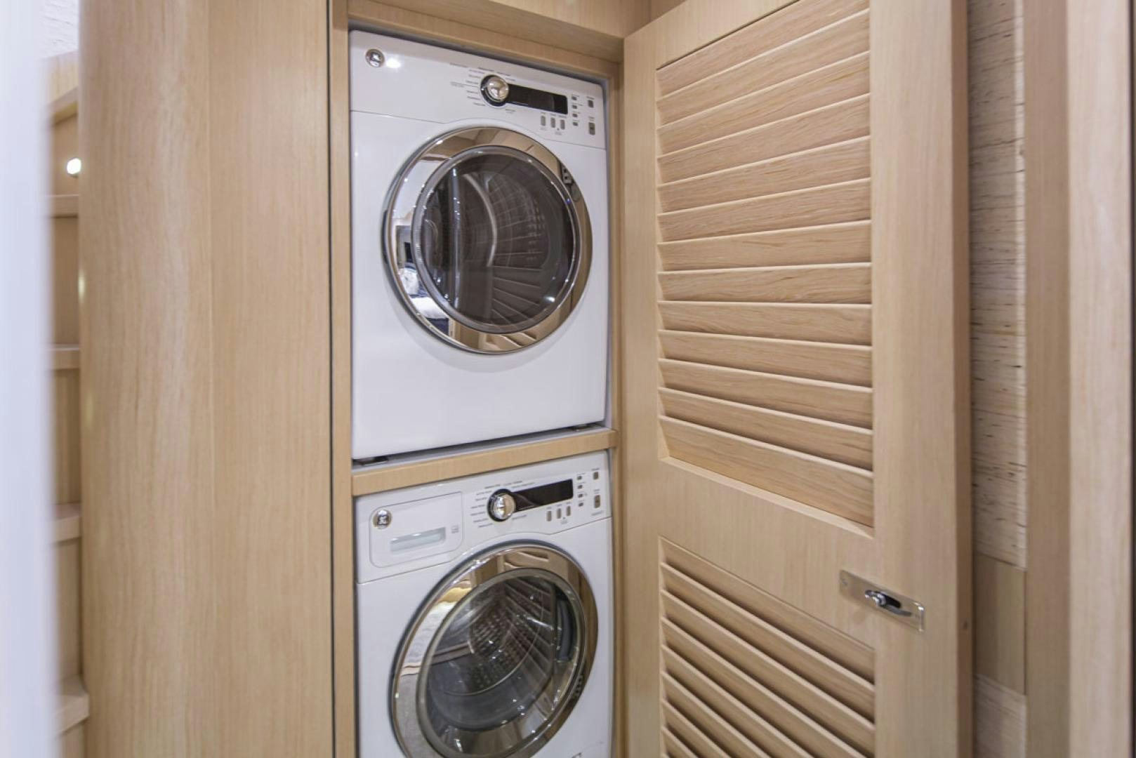 a closet with a washing machine aboard PARAGON COCKPIT Yacht for Sale
