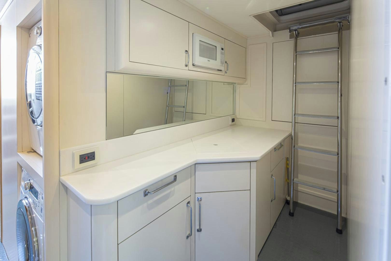 a room with a sink and a ladder aboard PARAGON COCKPIT Yacht for Sale