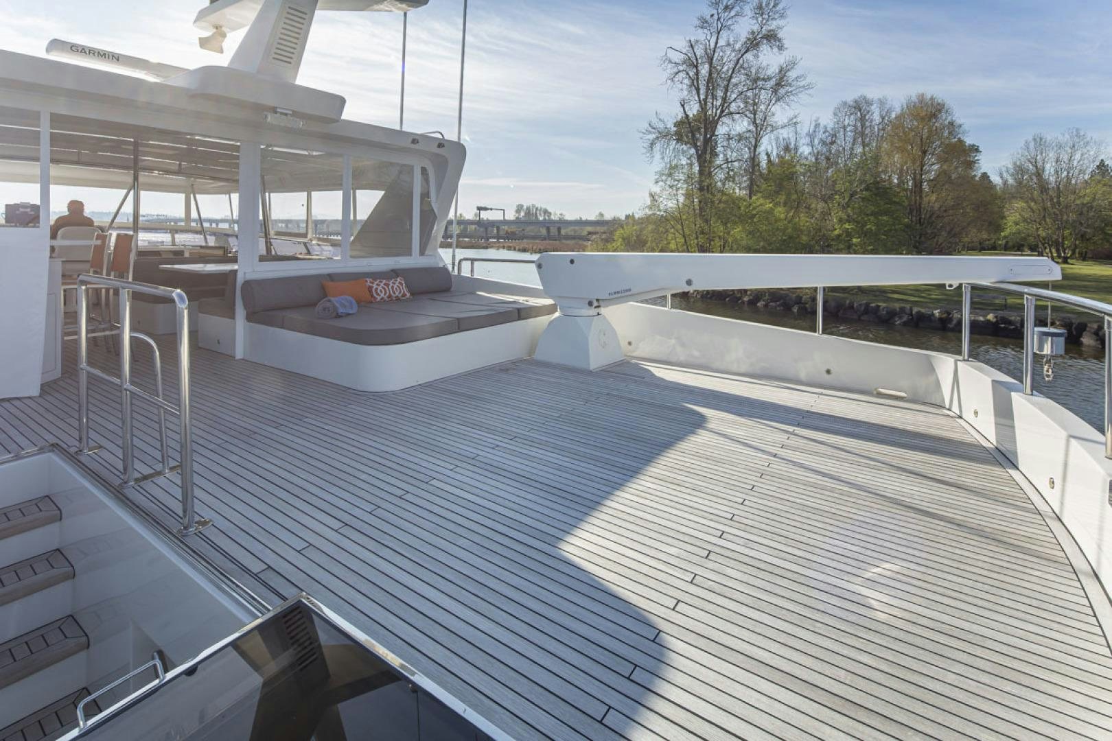 a deck with a railing and a building in the background aboard PARAGON COCKPIT Yacht for Sale