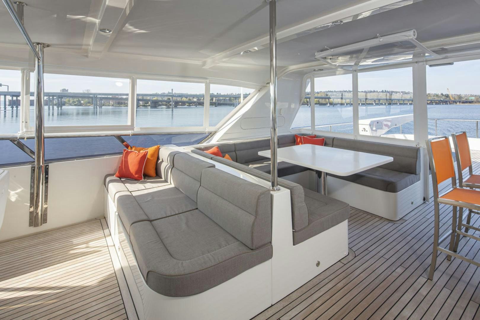 a room with a couch and a table aboard PARAGON COCKPIT Yacht for Sale