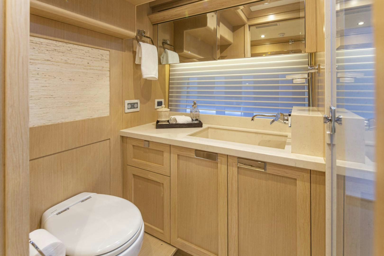 a bathroom with a sink and a toilet aboard PARAGON COCKPIT Yacht for Sale