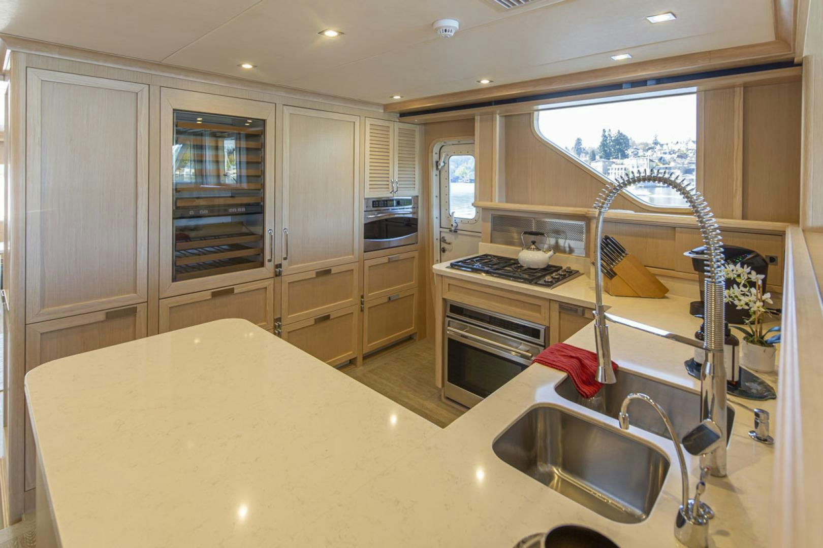 a kitchen with a sink and a stove aboard PARAGON COCKPIT Yacht for Sale