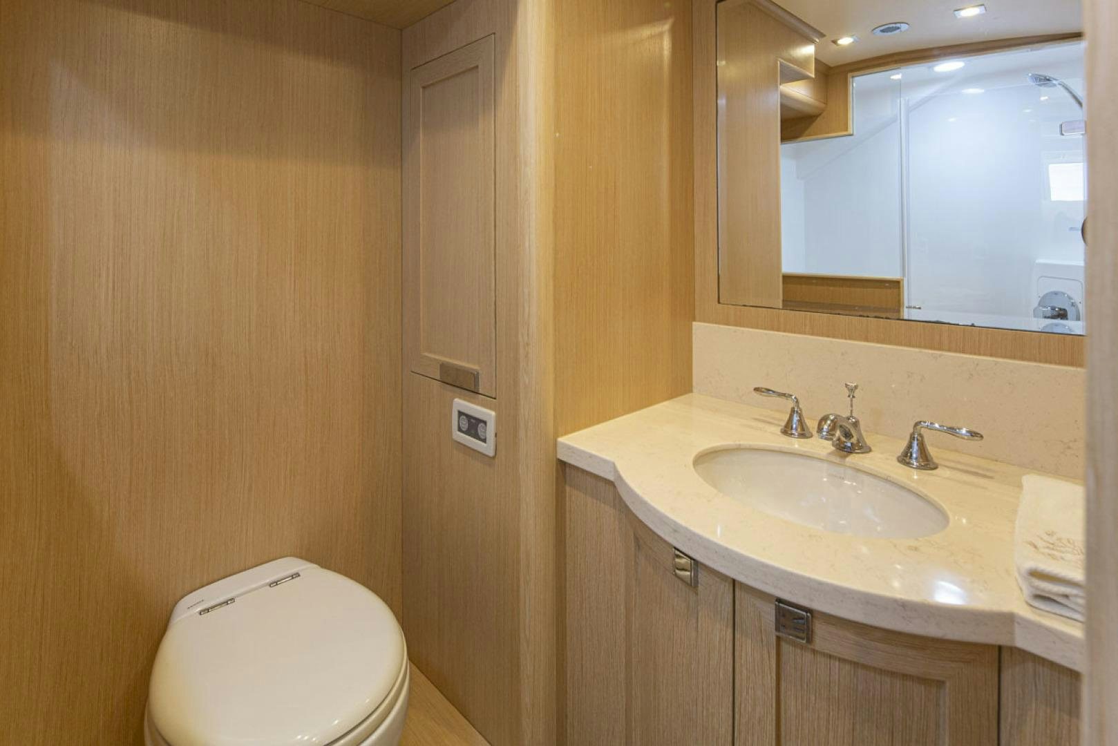 a bathroom with a sink and a toilet aboard PARAGON COCKPIT Yacht for Sale