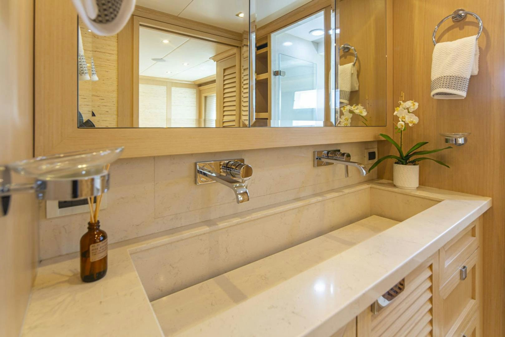 a bathroom with a sink and a mirror aboard PARAGON COCKPIT Yacht for Sale