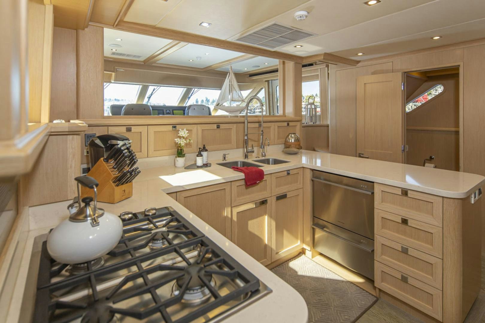 a kitchen with a stove and sink aboard PARAGON COCKPIT Yacht for Sale