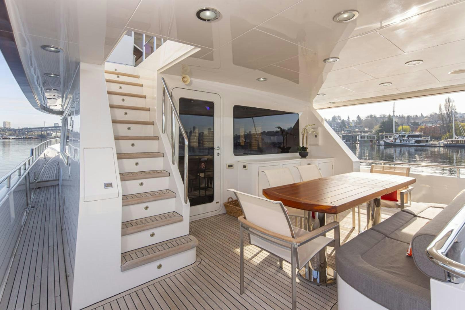 a boat with a table and chairs aboard PARAGON COCKPIT Yacht for Sale