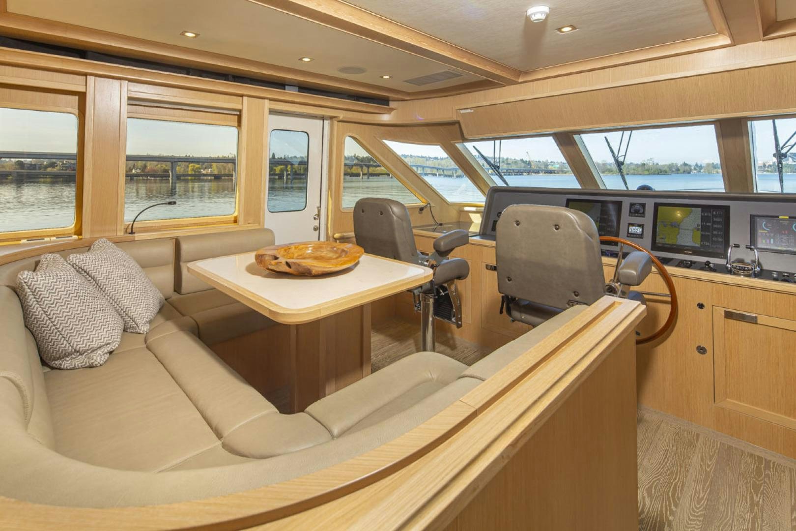 a table and chairs in a bus aboard PARAGON COCKPIT Yacht for Sale